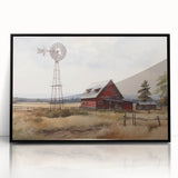 Framed wall art featuring a scenic landscape of a rustic barn, presented in a sleek black frame, perfect for enhancing home decor with a touch of countryside charm.