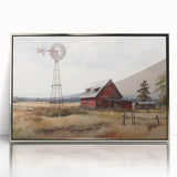 Framed wall art featuring a serene landscape with a rustic barn, enhanced by a silver-acrylic finish. Ideal for home decor, adding a touch of countryside charm.