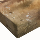 Close-up of a stretched canvas showcasing a vibrant landscape painting of a rustic barn amidst lush greenery, perfect for home decor and art enthusiasts.