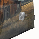 Close-up of a vibrant acrylic glass wall art piece showcasing a scenic landscape with rustic barns, rich colors, and intricate details, perfect for home decor.