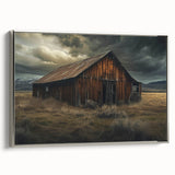 Framed canvas wall art showcasing a serene landscape with a rustic barn, accented by silver framing, ideal for enhancing home decor with a touch of tranquility.