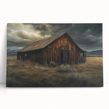 Stretched canvas wall art showcasing a serene landscape scene with rustic barns under a vibrant sunset, perfect for home decor enthusiasts. The artwork features rich colors and intricate details, enhancing any interior space. Ideal for rustic or farmhouse-style settings.