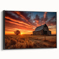 Framed canvas wall art showcasing a serene landscape with rustic barns, presented in a black frame, ideal for enhancing home décor with a touch of countryside charm.