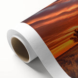 Rolled canvas artwork showcasing a serene landscape with rustic barns amidst vibrant greenery, designed for home decor display. Ideal for adding a tranquil touch to any room.