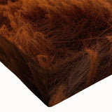 Close-up of a stretched canvas artwork showcasing a serene landscape with rustic barns, vibrant colors, and intricate details, perfect for home decor.