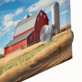 Close-up of a stunning acrylic glass wall art piece showcasing a vibrant landscape featuring rustic barns set against a dramatic sky, ideal for home decor.