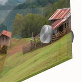 Close-up of an acrylic glass wall art piece showcasing a serene landscape with a rustic barn, vibrant colors, and intricate details, perfect for home decor.