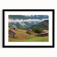 Framed wall art featuring a picturesque landscape of rustic barns against a serene backdrop, with a sleek black frame and matting, ideal for home decor.