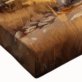 Close-up of a stretched canvas wall art piece depicting a serene landscape with vibrant green fields and rustic barns under a blue sky, perfect for home décor.