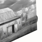 Close-up of a vibrant acrylic glass wall art piece showcasing a picturesque barn landscape, featuring lush greenery and a clear blue sky, ideal for rustic home decor.