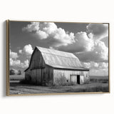 Framed canvas wall art showcasing a serene landscape with a rustic barn, accented by golden hues, ideal for enhancing home decor in modern or farmhouse-style settings.