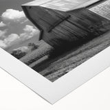 Vibrant rolled canvas wall art showcasing a scenic barn landscape with lush green fields and a clear blue sky, ideal for rustic home decor and nature enthusiasts.