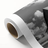 Rustic rolled canvas wall art featuring a serene landscape with a classic red barn and lush greenery, ideal for farmhouse decor. Perfect for adding a touch of rural charm to any living space.