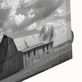 Close-up of a vibrant acrylic glass wall art piece showcasing a scenic landscape with rustic barns, rich colors, and intricate details, perfect for home decor.