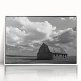 Framed wall art collection featuring a picturesque landscape with rustic barns, set in a white frame, showcasing vibrant colors and serene countryside vibes. Perfect for home decor enthusiasts seeking a nature-inspired aesthetic.