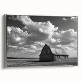 Framed canvas wall art showcasing a serene landscape with rustic barns, featuring a silver frame and rich color tones, perfect for home decor.