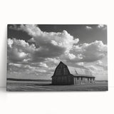 Stretched canvas artwork displaying a serene landscape with rustic barns under a blue sky, showcasing vibrant colors and natural beauty, perfect for home decor.