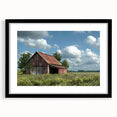 Black-framed landscape wall art featuring a serene barn scene with vibrant colors, perfect for adding rustic charm to home decor. Ideal for farmhouse-themed interiors.