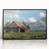 Framed acrylic wall art showcasing a picturesque landscape with rustic barns, set against a serene backdrop, featuring a sleek black frame for modern decor.