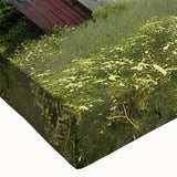 Close-up view of a stretched canvas featuring a vibrant landscape of a rustic barn set against a colorful sunset, showcasing rich hues of orange and blue, perfect for home decor.