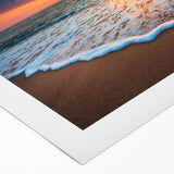Rolled canvas showcasing a serene beach landscape wall art design with vibrant colors, beautifully packaged in a protective cardboard tube for easy display.