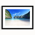 Framed black wall art featuring a serene beach landscape with soft waves and a clear blue sky, designed to enhance home decor with a calming aesthetic.