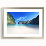 Framed wall art collection showcasing serene beach landscapes, featuring a silver mat and elegant framing, perfect for home decor enhancement.