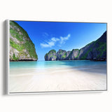 Framed canvas wall art showcasing a serene beach landscape design, featuring vibrant colors and intricate details, displayed from a side view against a white background.