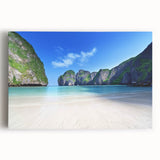 Stretched canvas wall art showcasing a serene beach landscape, featuring vibrant blues and sandy tones, ideal for coastal-themed decor in homes or offices.