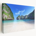 Stretched canvas artwork showcasing a serene beach landscape with vibrant colors and gentle waves, perfect for home decor and enhancing living spaces.