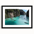 Framed wall art featuring a serene beach landscape with vibrant colors and a sleek black mat, ideal for home decor in coastal-themed interiors.