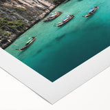 Vibrant rolled canvas artwork showcasing a serene beach landscape with soft waves and a colorful sunset, ideal for home decor or coastal-themed interiors.