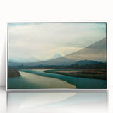 Framed acrylic wall art depicting a serene beach landscape with soft blue skies and gentle waves, showcased in a white frame ideal for home decor.