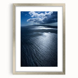 Framed wall art featuring a serene beach landscape design with a silver mat, ideal for home decor. The artwork showcases vibrant colors and tranquil scenery.