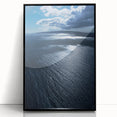 Framed wall art collection showcasing a serene beach landscape with vibrant colors, set in a sleek black frame, perfect for coastal-themed decor.