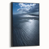 Framed canvas wall art showcasing a serene beach landscape with vibrant colors, black frame highlighting the design, perfect for home decor enhancement.
