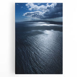 Stretched canvas wall art showcasing a serene beach landscape, featuring soft pastel colors and gentle waves, perfect for coastal-themed decor.