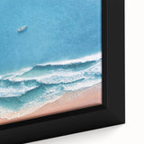 Close-up of a framed canvas wall art piece showcasing a tranquil beach landscape with vibrant colors and intricate details, perfect for home decor.