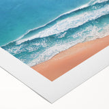Vibrant rolled canvas artwork showcasing a serene beach landscape with soft waves and a clear blue sky, ideal for home decor or relaxation.