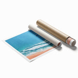Vibrant rolled canvas print showcasing a serene beach landscape with soft waves and a pastel sunset, ideal for home decor and relaxation-themed spaces.