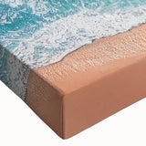 Close-up of a vibrant stretched canvas artwork depicting a serene beach landscape, showcasing soft pastel colors and intricate details, perfect for home decor.