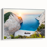 Framed canvas wall art showcasing a serene beach landscape with vibrant blues and sandy tones, ideal for coastal decor. Side view highlights its elegant white frame.