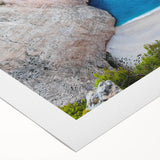 Stunning rolled canvas artwork showcasing a serene beach landscape with vibrant colors, ideal for home decor, packaged in a protective cardboard tube.