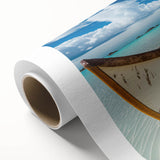 Beautiful rolled canvas wall art depicting a serene beach landscape with vibrant colors, showcasing a tranquil sunset over the ocean, perfect for home decor.