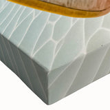 Close-up of a stretched canvas artwork showcasing a vibrant beach landscape design, featuring soft pastel colors and serene waves, ideal for coastal decor.