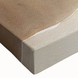 Close-up of a stretched canvas wall art piece showcasing a vibrant beach landscape design, featuring vivid blues and sandy tones, ideal for home decor.