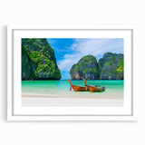 Framed wall art featuring a serene beach landscape design with soft blue and beige tones, displayed in a white mat, perfect for coastal-themed decor.