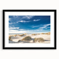 Framed wall art featuring a serene beach landscape with vibrant colors, black matting, and a sleek black frame, perfect for coastal-themed decor.