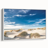 Framed canvas wall art showcasing a serene beach landscape with soft waves and a clear blue sky, designed to enhance home decor with a tranquil vibe.