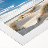 Rolled canvas wall art showcasing a serene beach landscape design with vibrant blue skies and sandy shores, perfect for coastal decor in modern interiors.